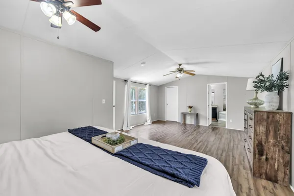 a living room with furniture rug and wooden floor