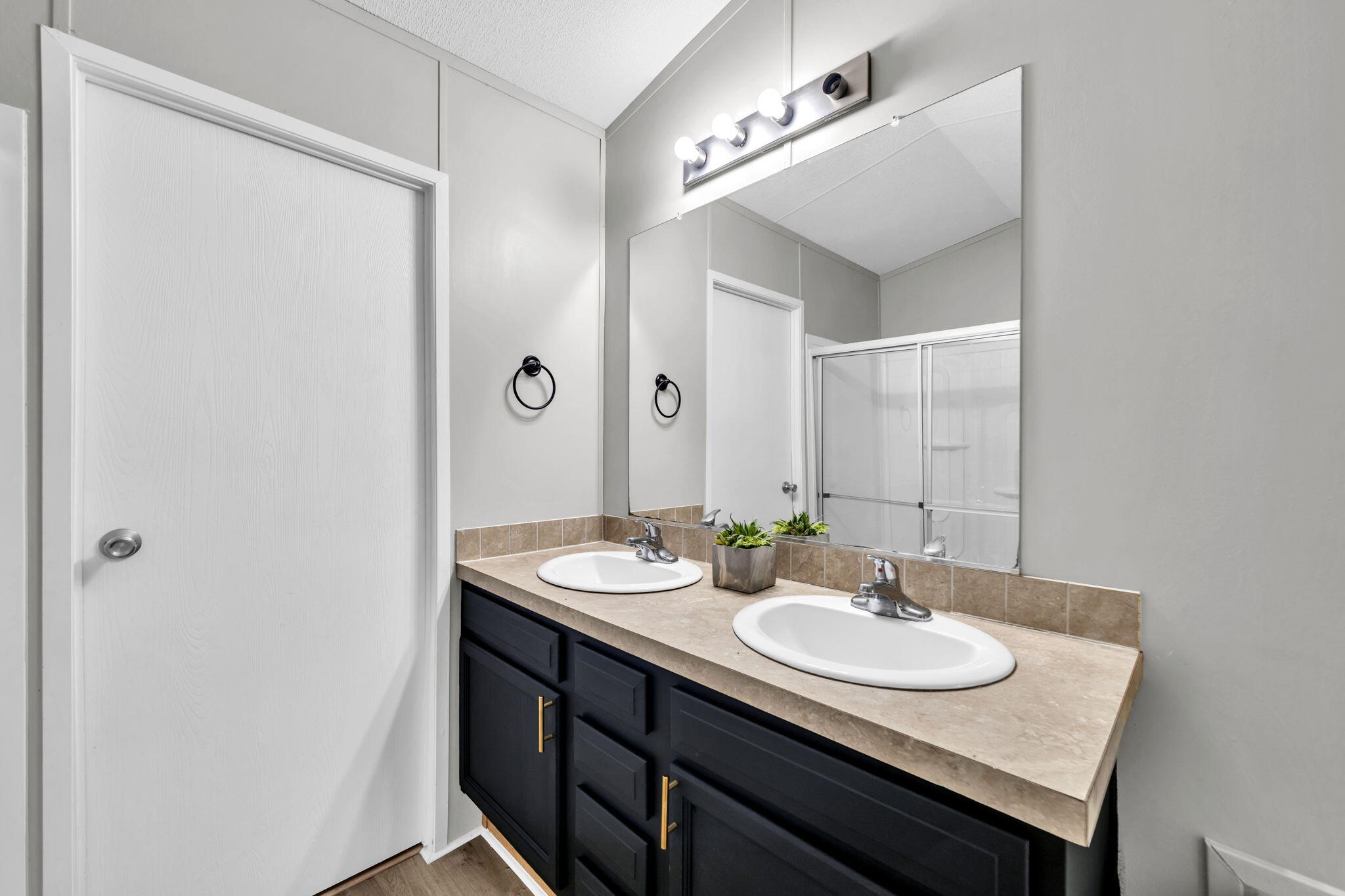 5216 Galiver Cutoff Baker, FL 32531 - Photo 31 of 51 a bathroom with a sink and a mirror