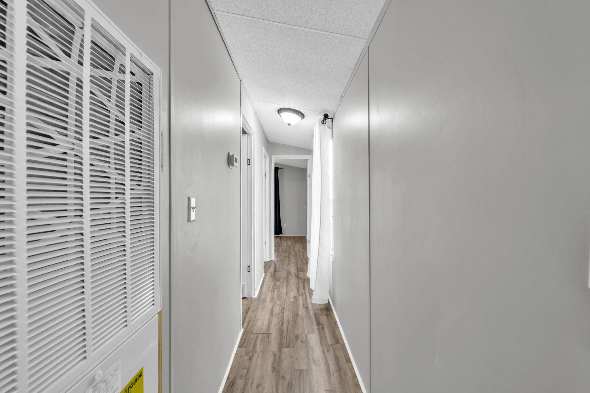 5216 Galiver Cutoff Baker, FL 32531 - Photo 34 of 51 a view of hallway with wooden floor