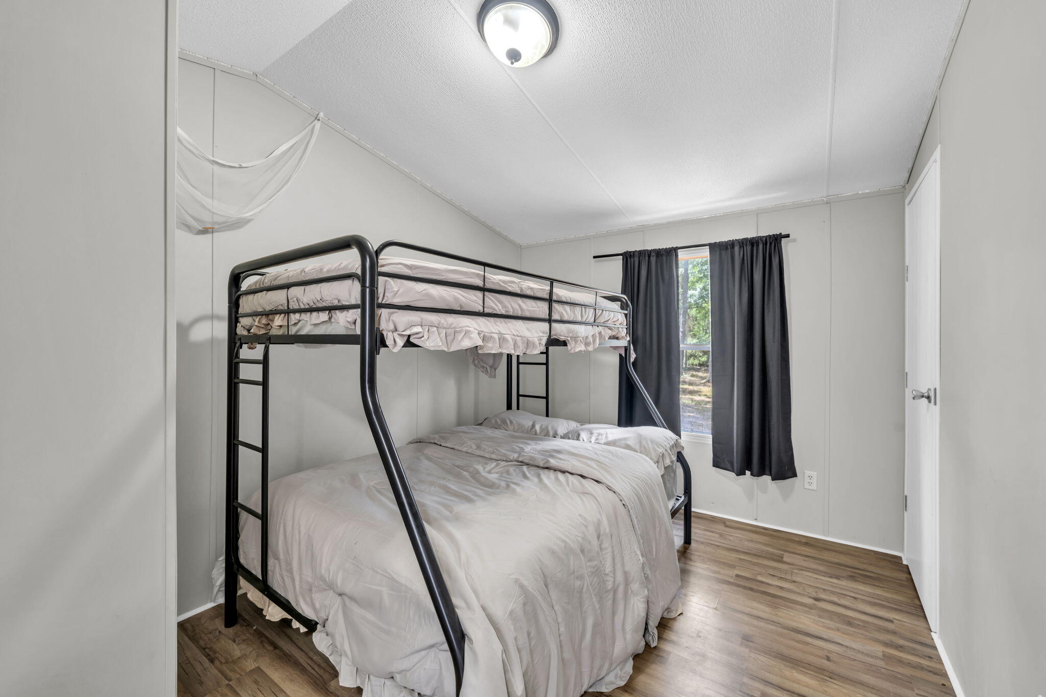 5216 Galiver Cutoff Baker, FL 32531 - Photo 35 of 51 a bedroom with a bed and a mirror