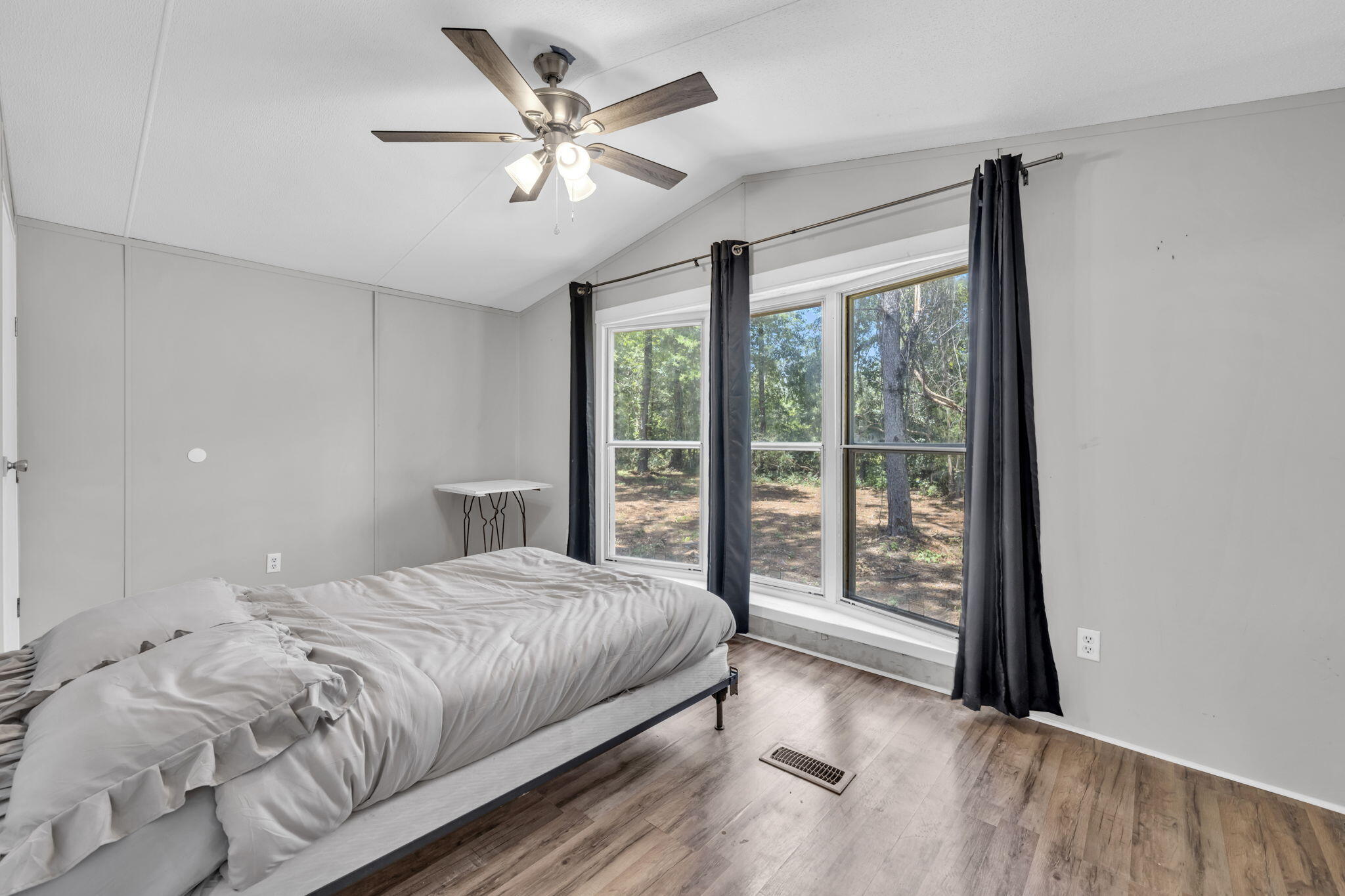 5216 Galiver Cutoff Baker, FL 32531 - Photo 37 of 51 a bedroom with a large bed and a large window