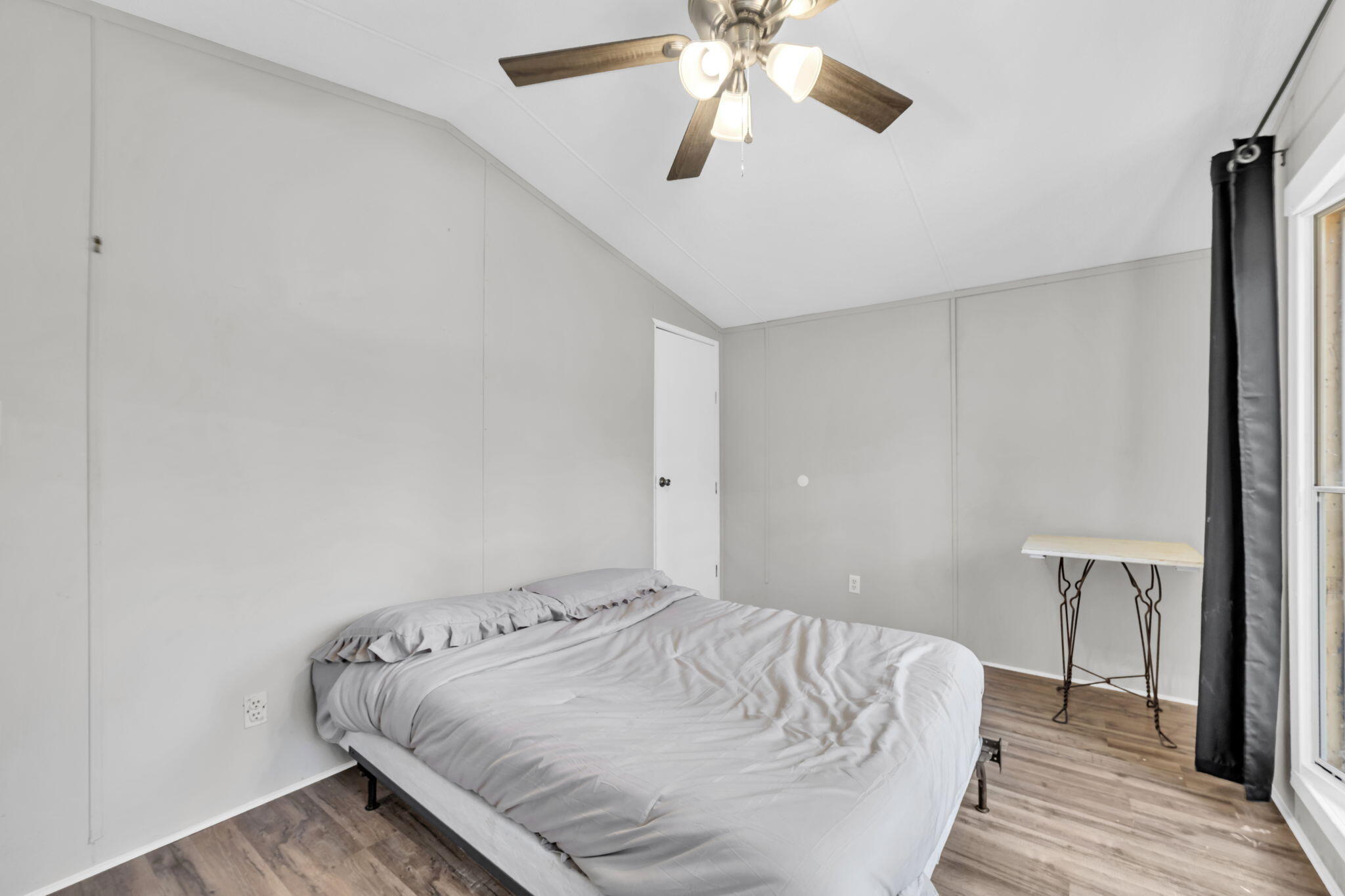 5216 Galiver Cutoff Baker, FL 32531 - Photo 38 of 51 a bedroom with a bed and a chandelier