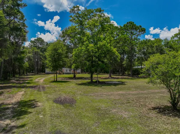 an aerial view of house with yard