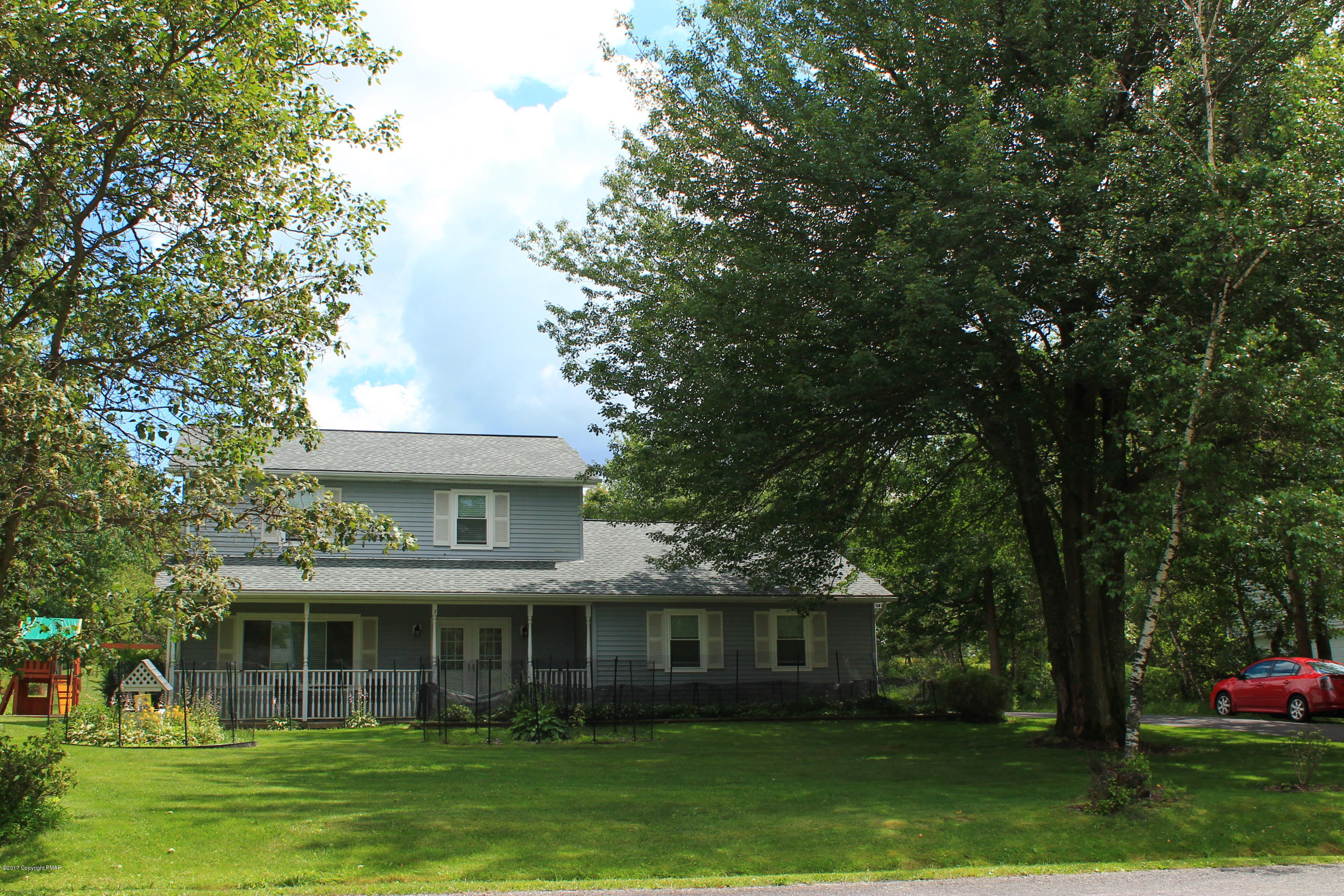 169 Ryan Road Blakeslee, PA 18610 - Photo 1 of 22 a front view of a house with a garden