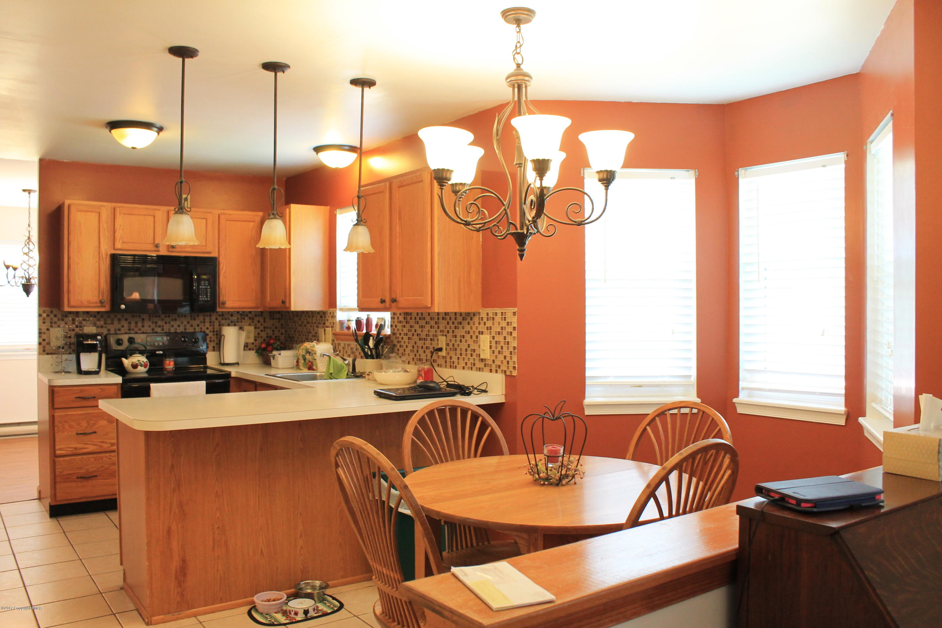 169 Ryan Road Blakeslee, PA 18610 - Photo 4 of 22 a kitchen with a dining table chairs and sink