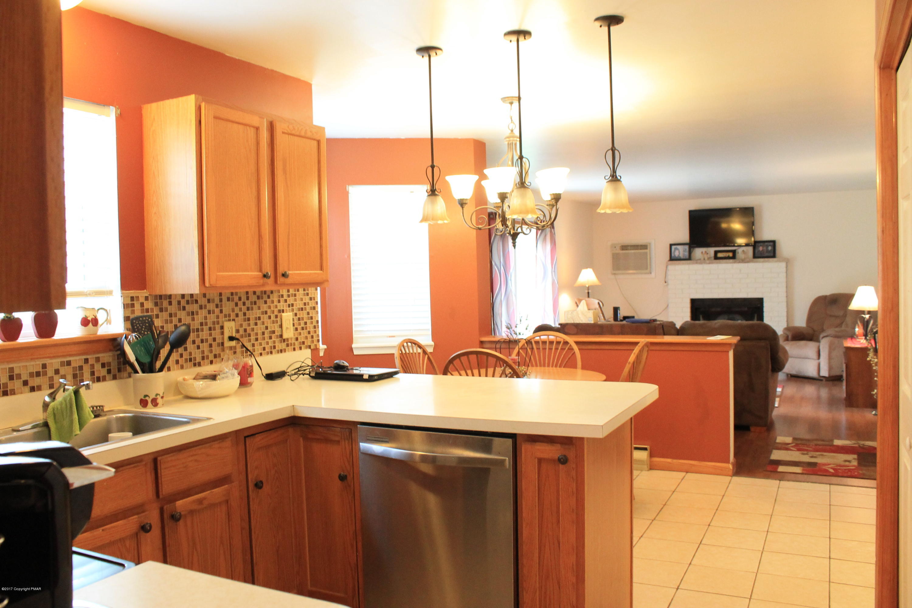 169 Ryan Road Blakeslee, PA 18610 - Photo 5 of 22 a kitchen with a sink a counter and chairs