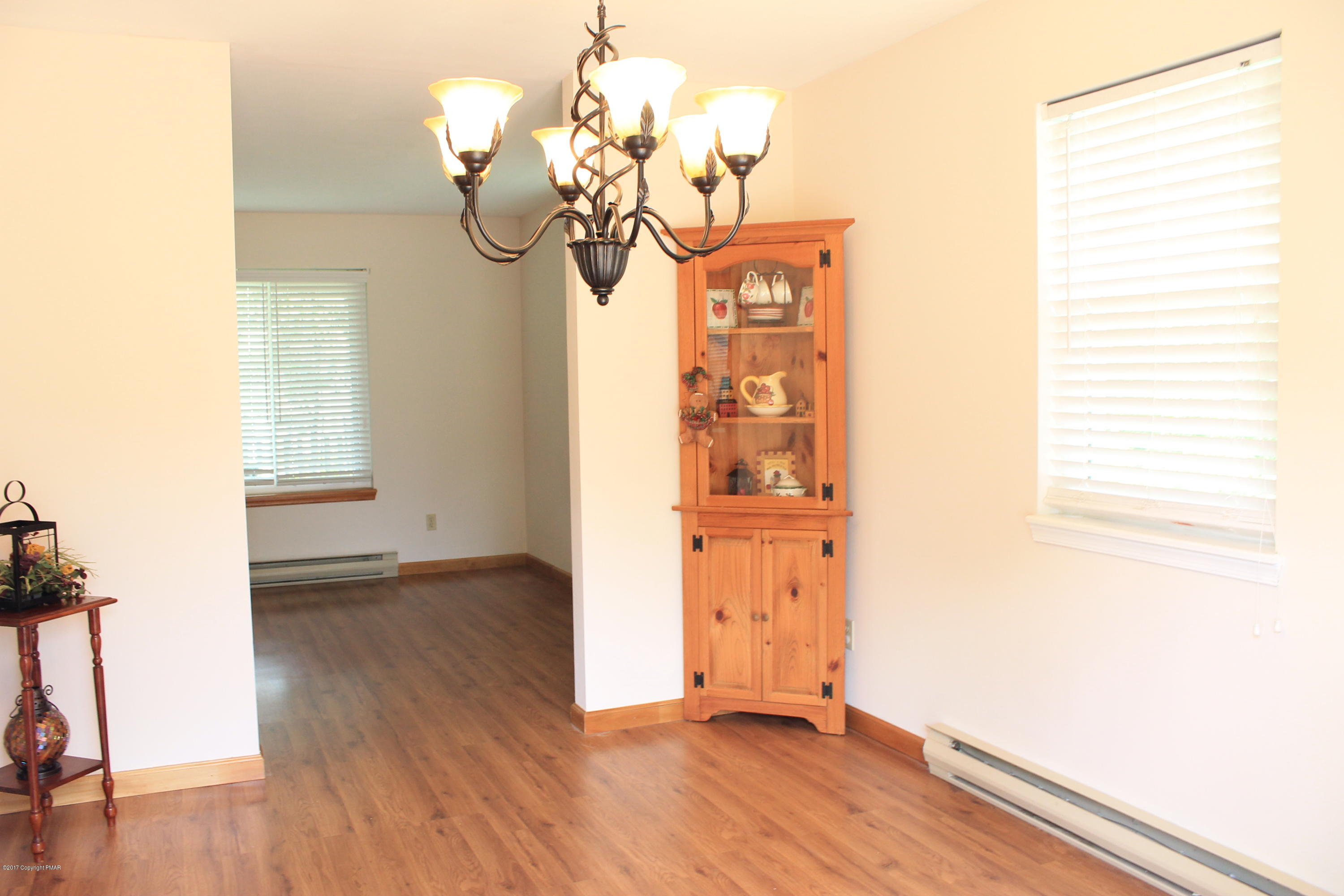 169 Ryan Road Blakeslee, PA 18610 - Photo 7 of 22 a view of a room with wooden floor and chandelier