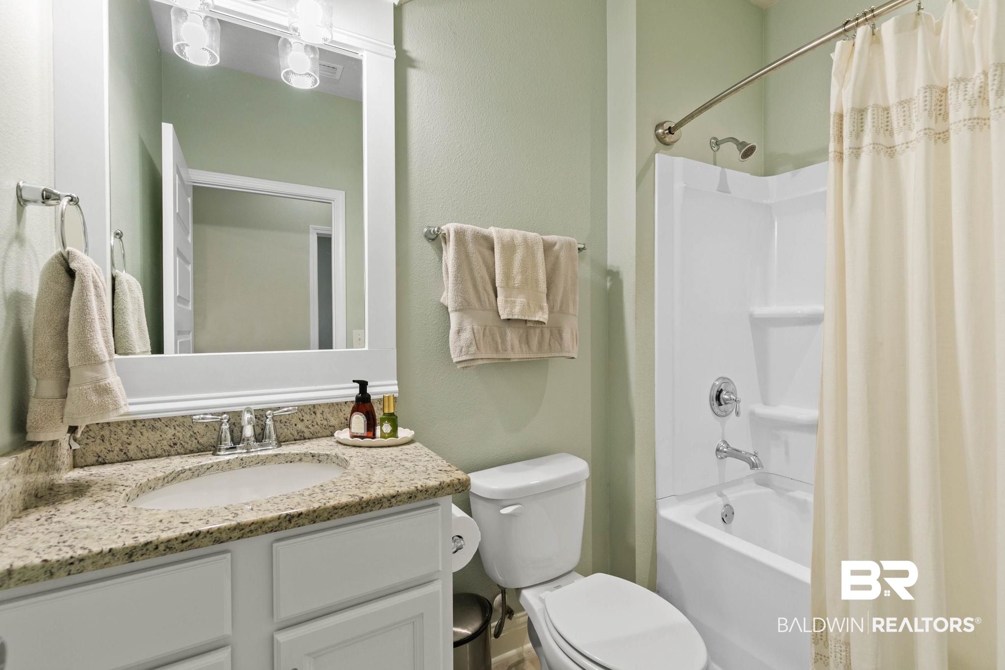31187 Spoonbill Road Daphne, AL 36527 - Photo 42 of 85 Bathroom vanity featuring a polished stone countertop and an undermount sink