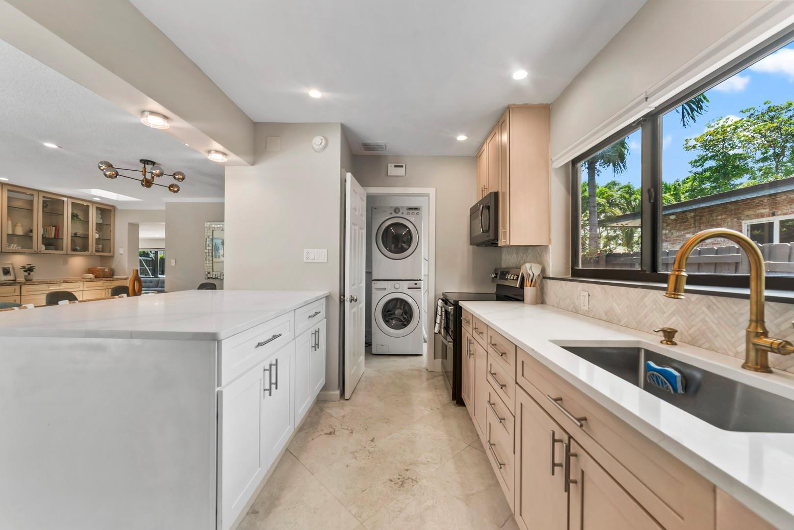 1908 Northeast 27th Street Wilton Manors, FL 33306 - Photo 13 of 38 Laundry room beyond the kitchen....