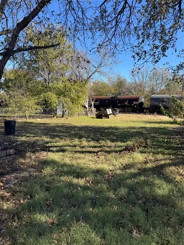 a view of a yard with an outdoor space