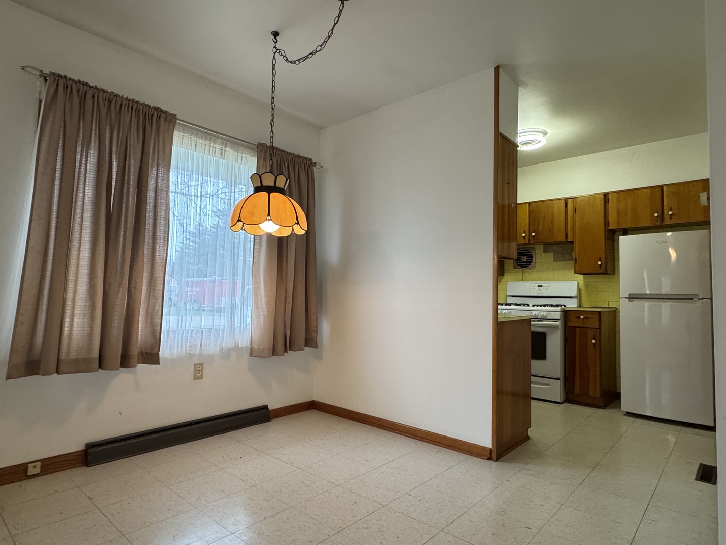 101 West High Street La Moille, IL 61330 - Photo 11 of 34 a kitchen with stainless steel appliances granite countertop a refrigerator a stove and a sink