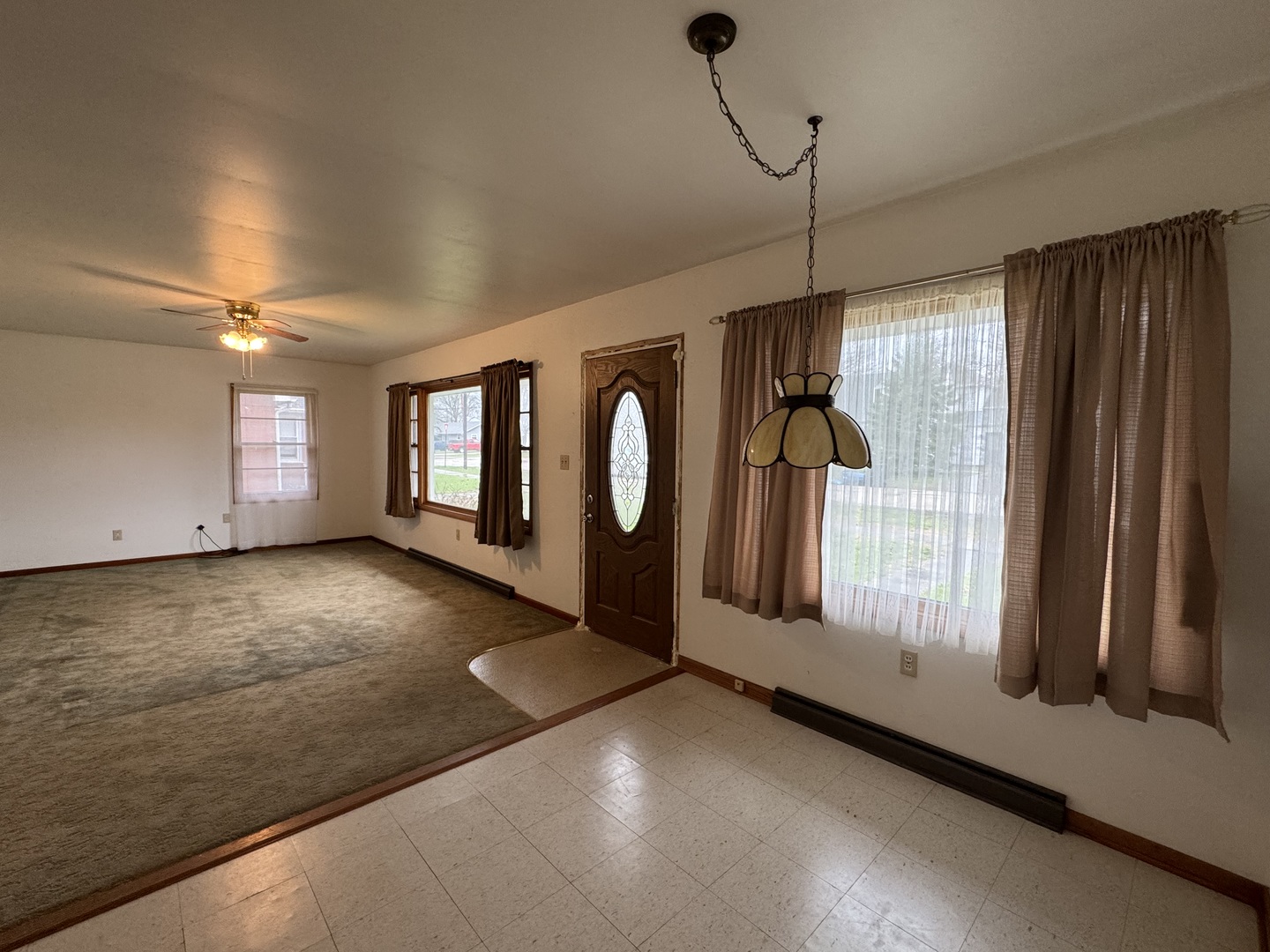 101 West High Street La Moille, IL 61330 - Photo 12 of 34 a view of a room with wooden floor and windows
