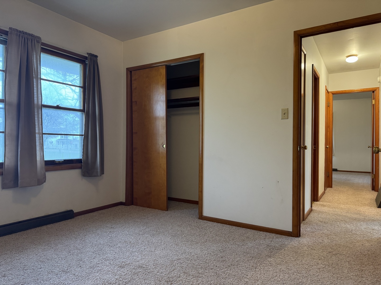 101 West High Street La Moille, IL 61330 - Photo 17 of 34 an empty room with windows and closet