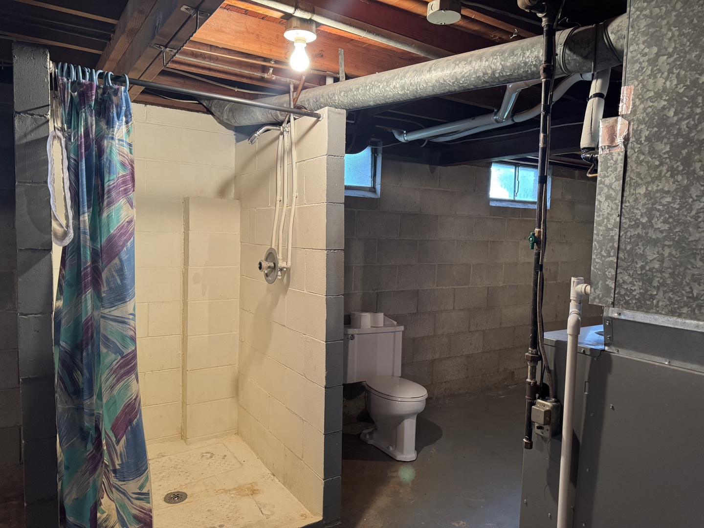 101 West High Street La Moille, IL 61330 - Photo 25 of 34 a bathroom with a toilet and shower