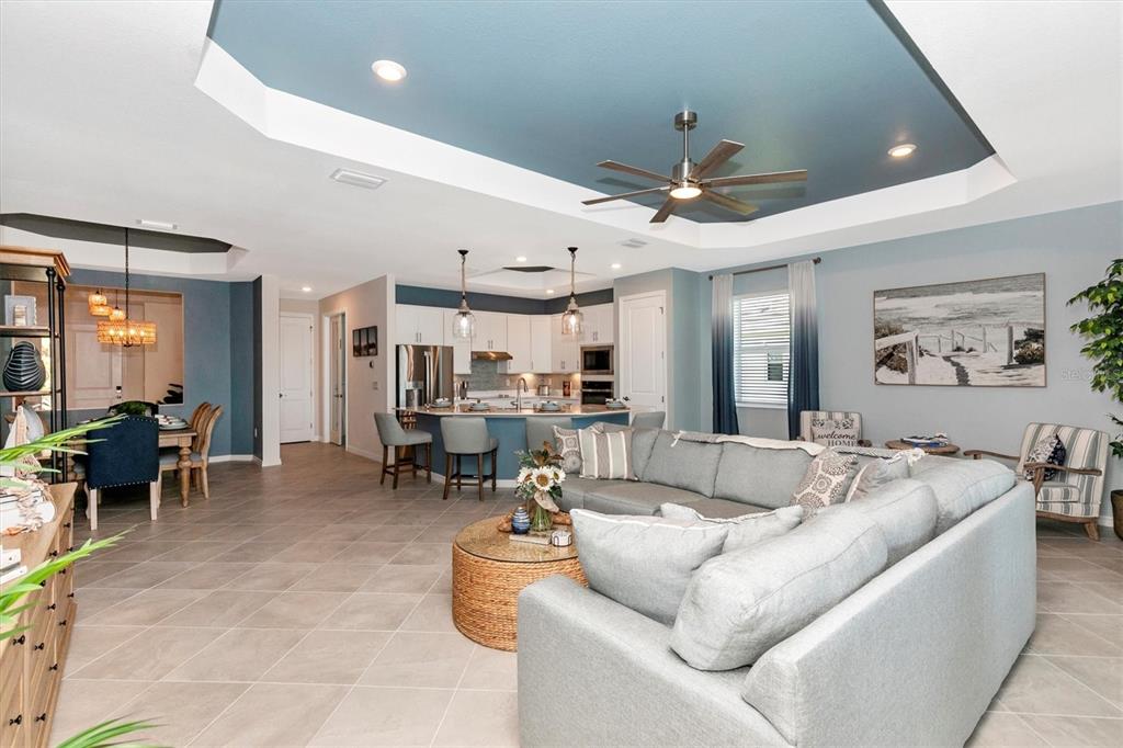 17180 Jadestone Court Venice, FL 34293 - Photo 14 of 98 a living room with furniture and a large window