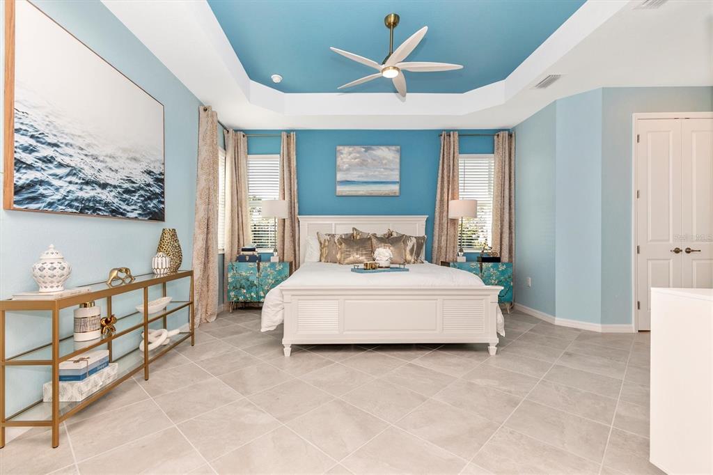 17180 Jadestone Court Venice, FL 34293 - Photo 16 of 98 a spacious bedroom with a bed and a window