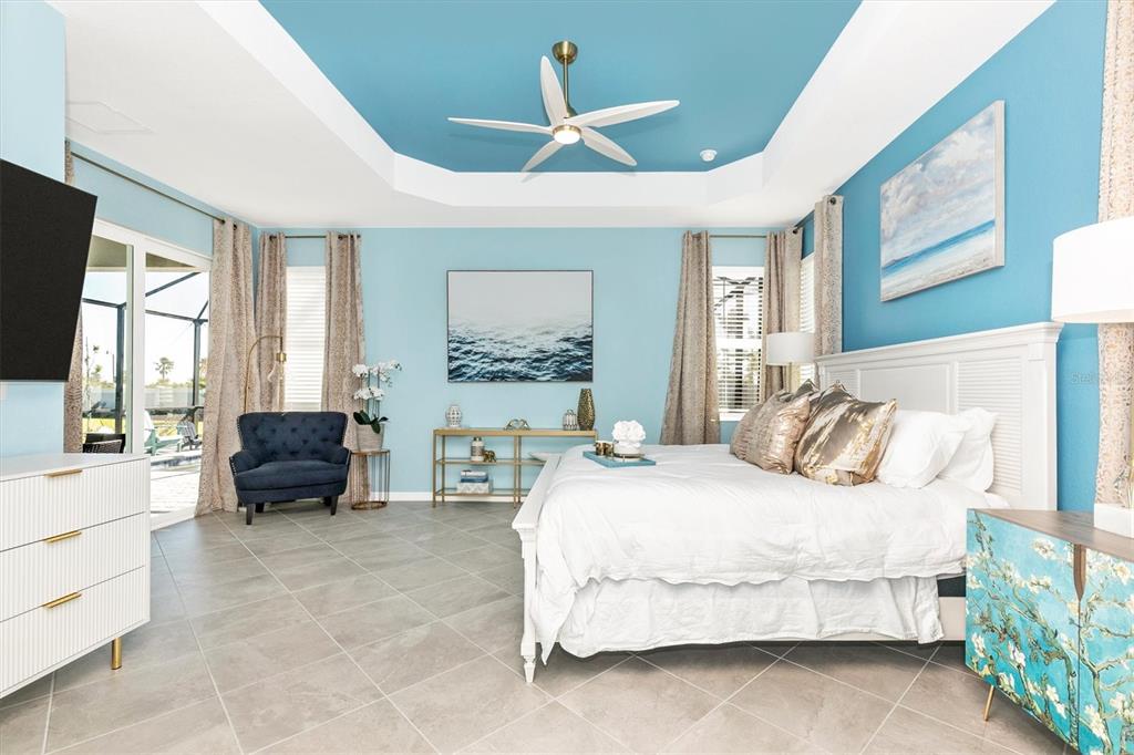 17180 Jadestone Court Venice, FL 34293 - Photo 18 of 98 a bedroom with a bed and a large window