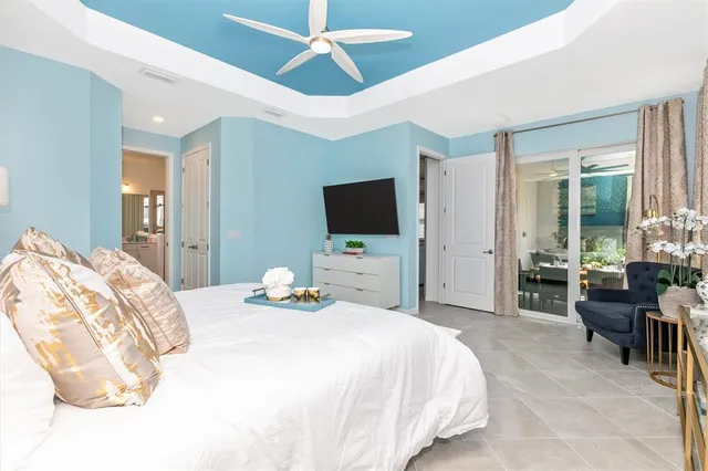 a bedroom with a bed and a night stand