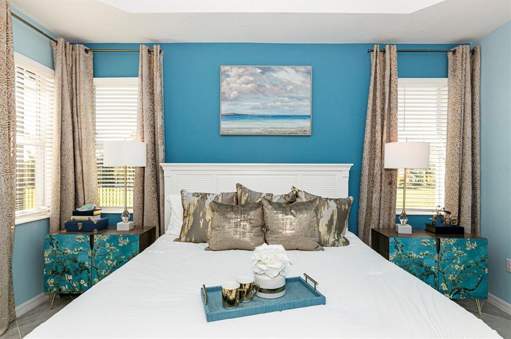 17180 Jadestone Court Venice, FL 34293 - Photo 20 of 98 a bedroom with a bed and a large window