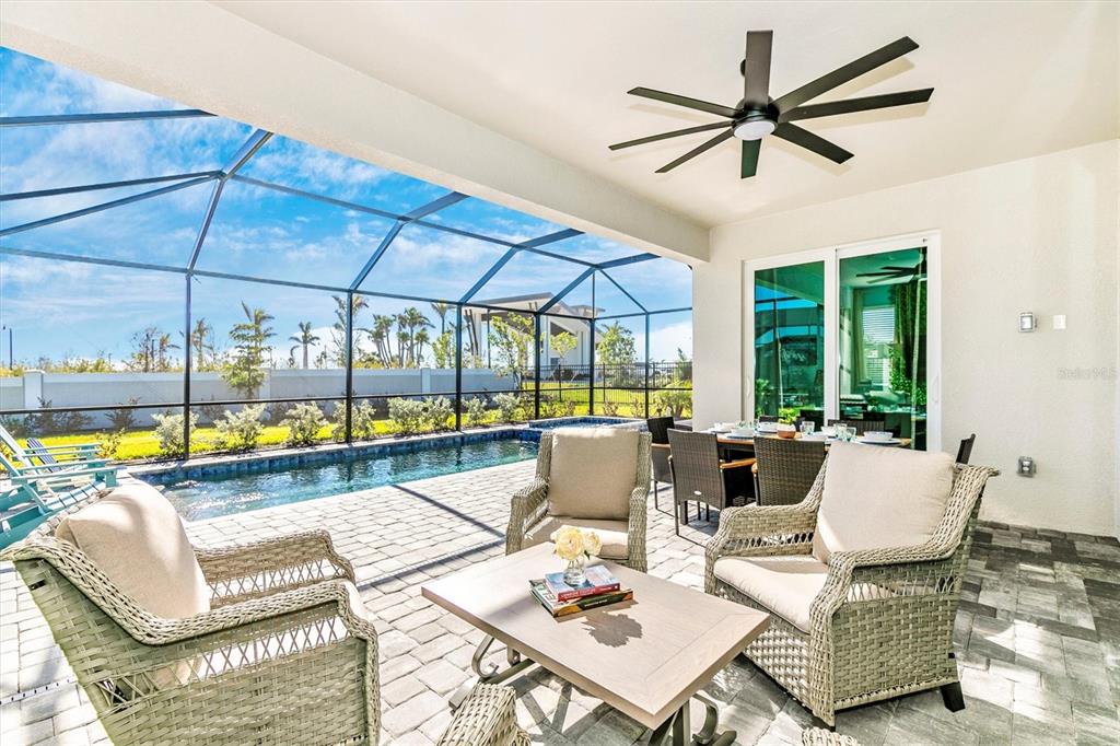 17180 Jadestone Court Venice, FL 34293 - Photo 37 of 98 a living room with furniture and a large window