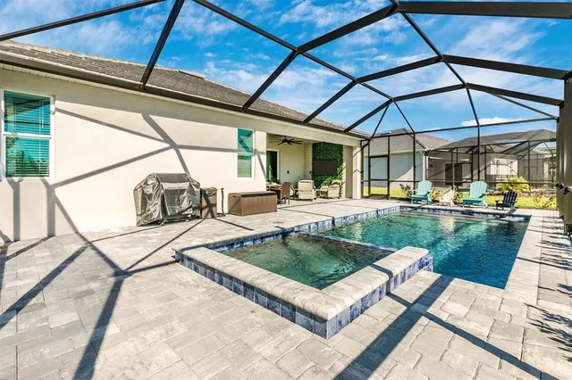 a building outdoor space with patio furniture and potted plants