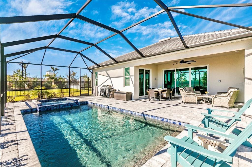 17180 Jadestone Court Venice, FL 34293 - Photo 44 of 98 a view of swimming pool with outdoor seating