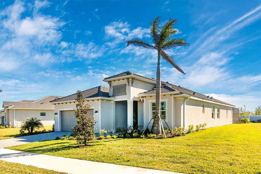17180 Jadestone Court Venice, FL 34293 - Photo 46 of 98 a front view of a house with yard