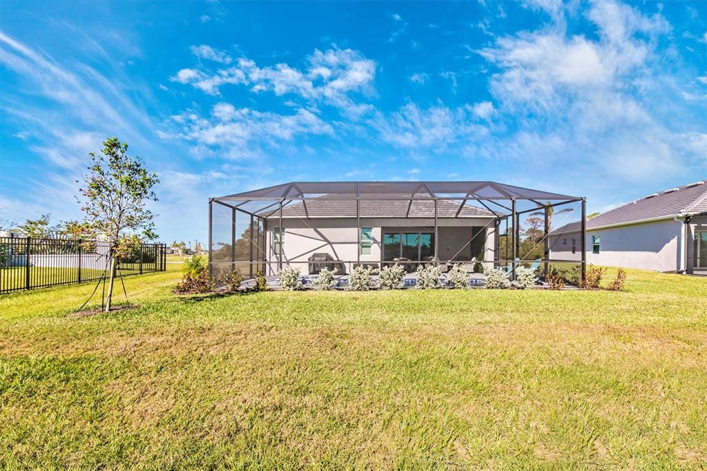 17180 Jadestone Court Venice, FL 34293 - Photo 49 of 98 a view of a house with swimming pool and sitting area