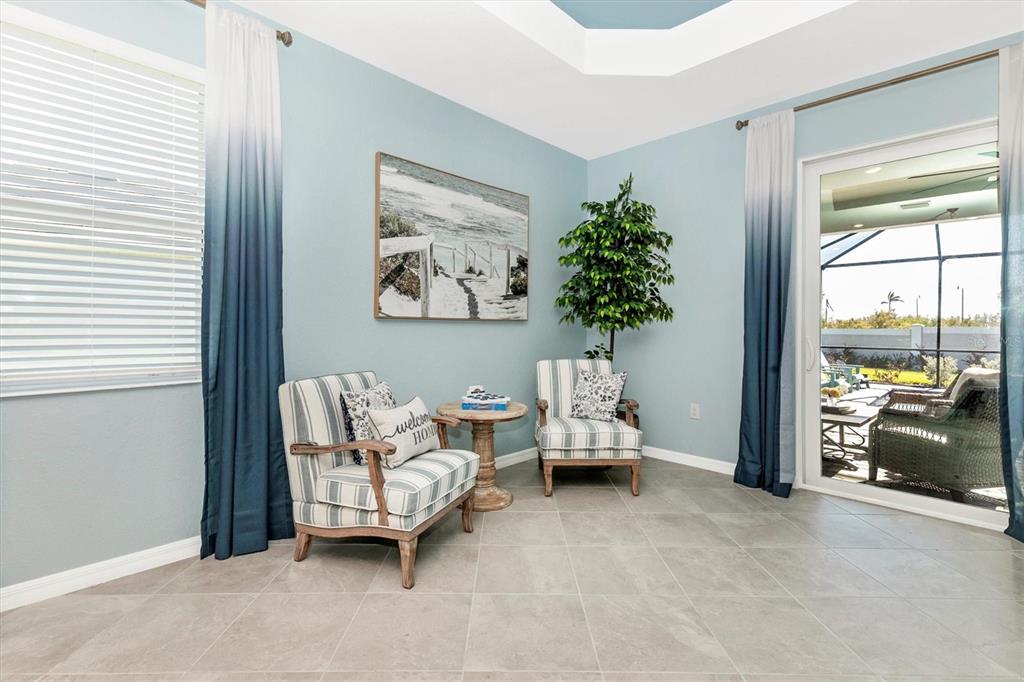 17180 Jadestone Court Venice, FL 34293 - Photo 7 of 98 a bed room with furniture and a window