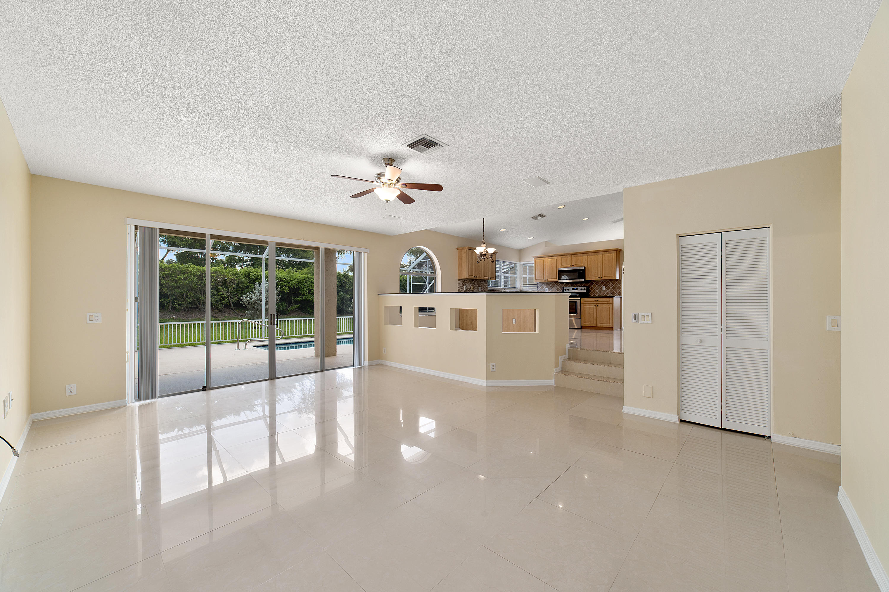 19554 Black Olive Lane Boca Raton, FL 33498 - Photo 17 of 40 a view of a livingroom with a kitchen