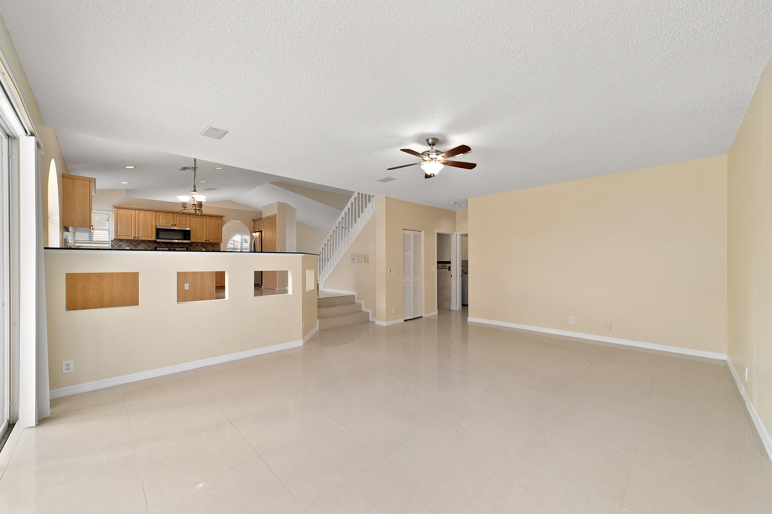19554 Black Olive Lane Boca Raton, FL 33498 - Photo 18 of 40 an empty room with a kitchen and a sink
