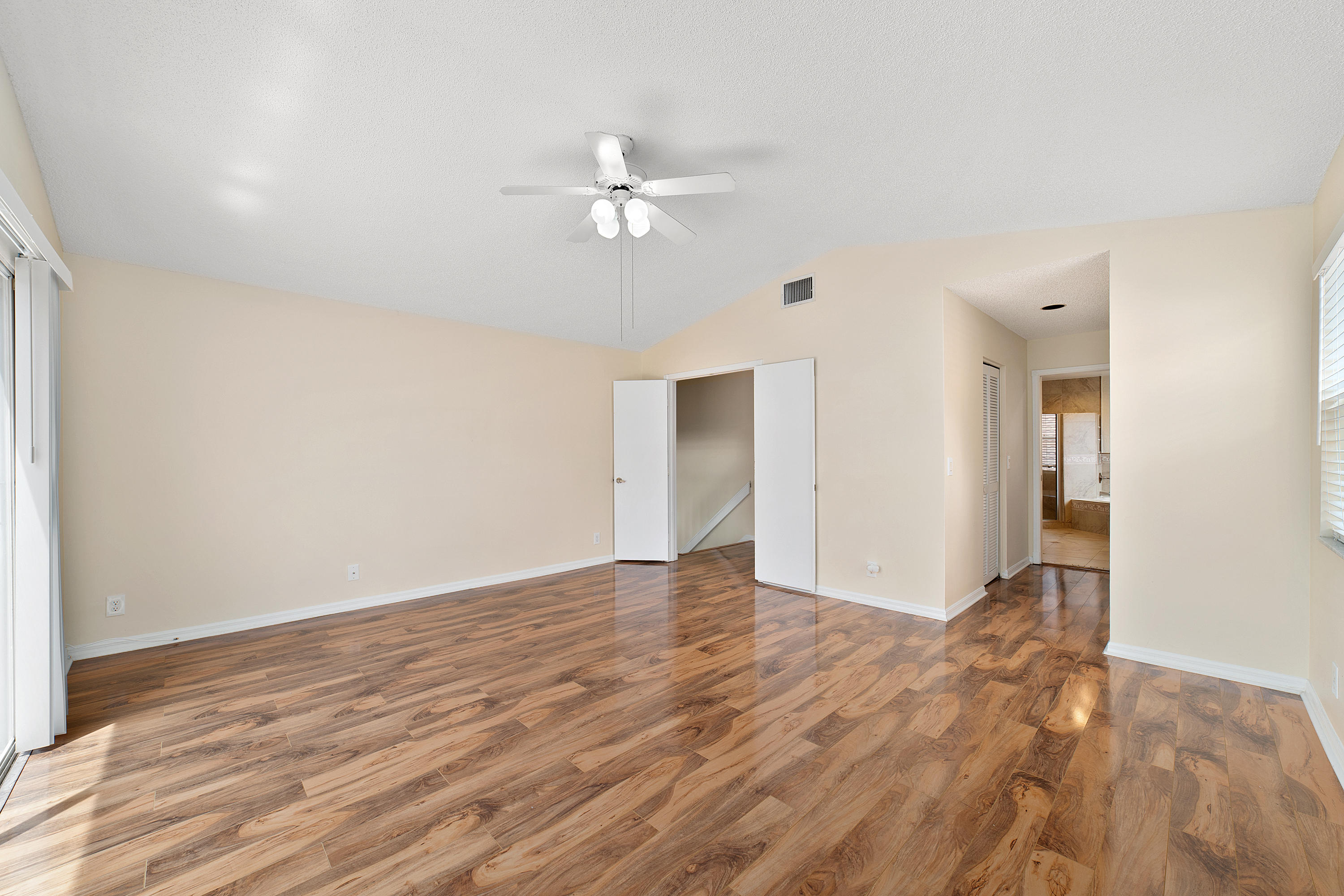 19554 Black Olive Lane Boca Raton, FL 33498 - Photo 21 of 40 a view of an empty room with wooden floor