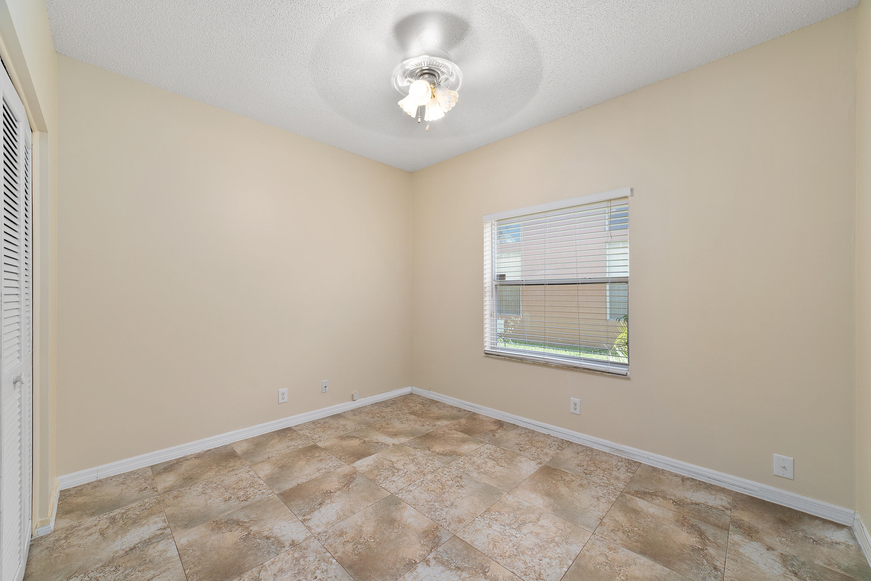 19554 Black Olive Lane Boca Raton, FL 33498 - Photo 30 of 40 an empty room with a window