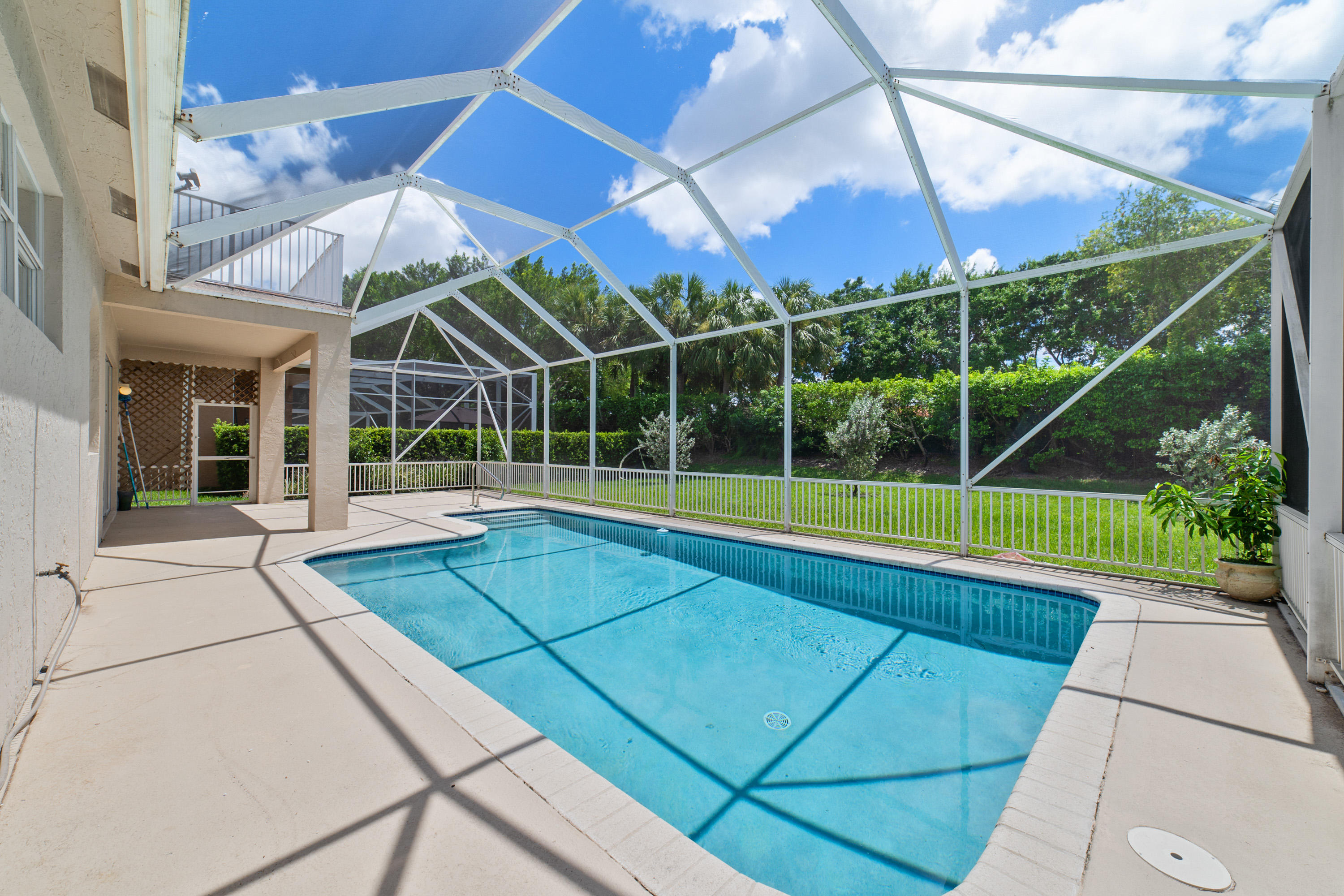 19554 Black Olive Lane Boca Raton, FL 33498 - Photo 32 of 40 a view of a backyard with a swimming pool