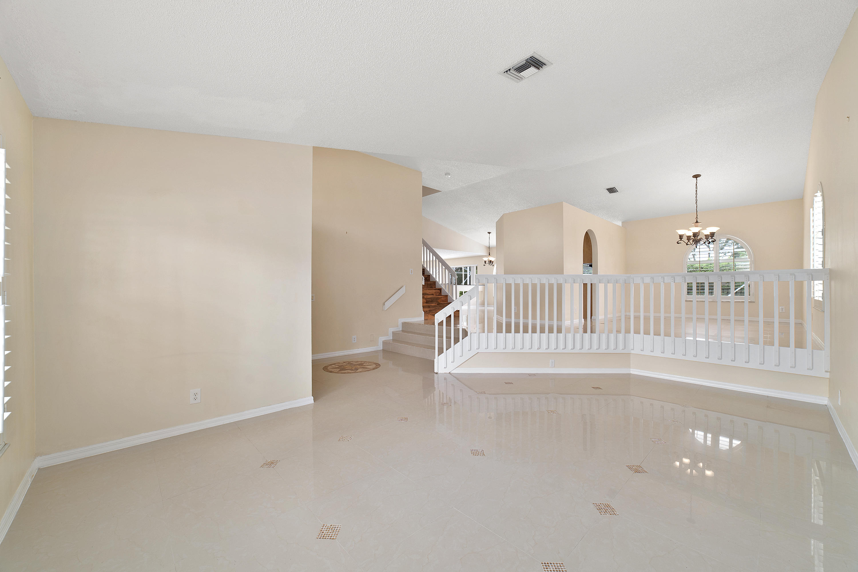 19554 Black Olive Lane Boca Raton, FL 33498 - Photo 6 of 40 a view of livingroom with stairs