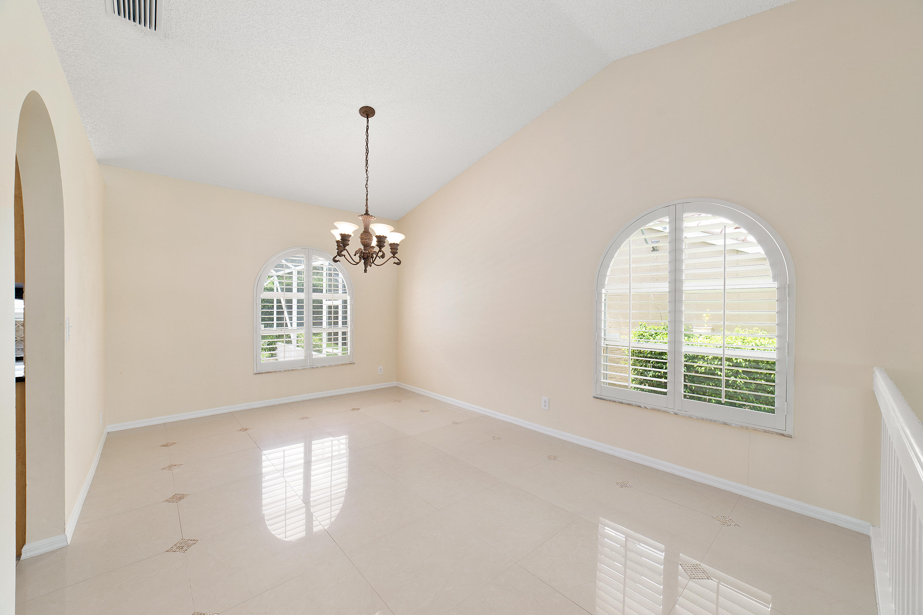 19554 Black Olive Lane Boca Raton, FL 33498 - Photo 8 of 40 an empty room with windows and ceiling fan