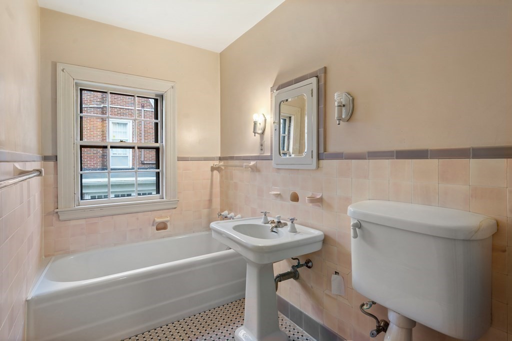 110 Cedar Street Newton, MA 02459 - Photo 19 of 28 a bathroom with a sink a toilet and bathtub