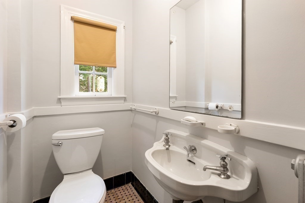 110 Cedar Street Newton, MA 02459 - Photo 8 of 28 a bathroom with a toilet sink and mirror