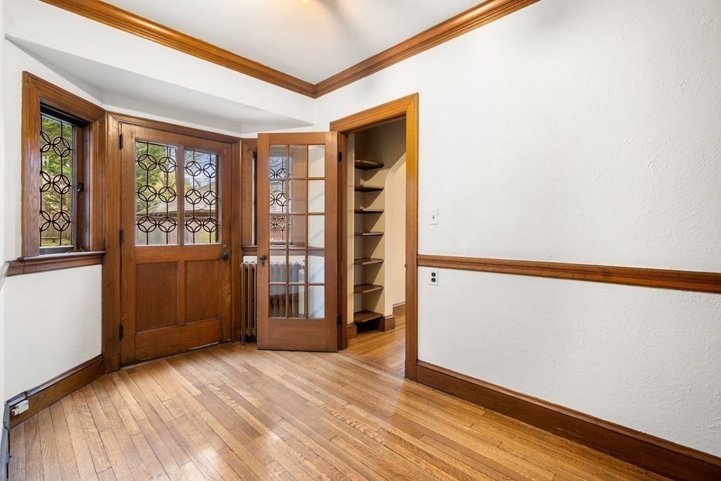 110 Cedar Street Newton, MA 02459 - Photo 9 of 28 a view of an empty room with window and wooden floor