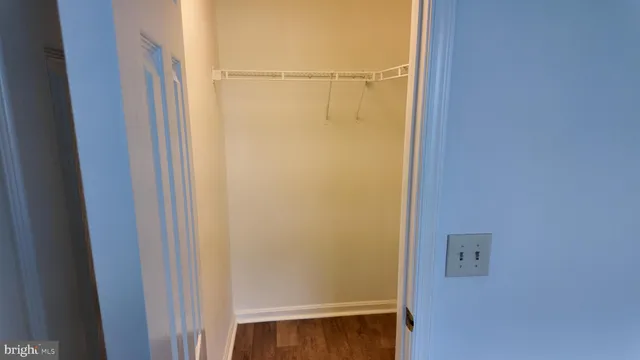 a kitchen with a refrigerator sink and cabinets