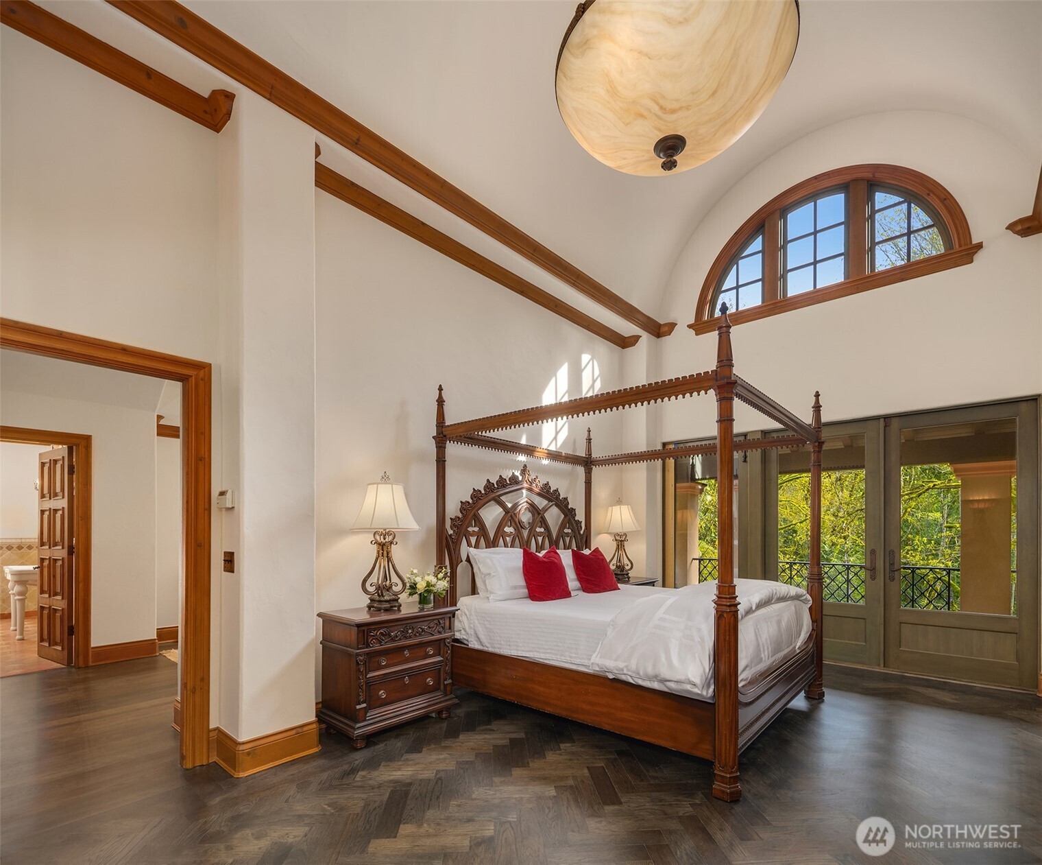 5565 248th Place Southeast Issaquah, WA 98029 - Photo 14 of 33 a bedroom with a bed a window and a chandelier