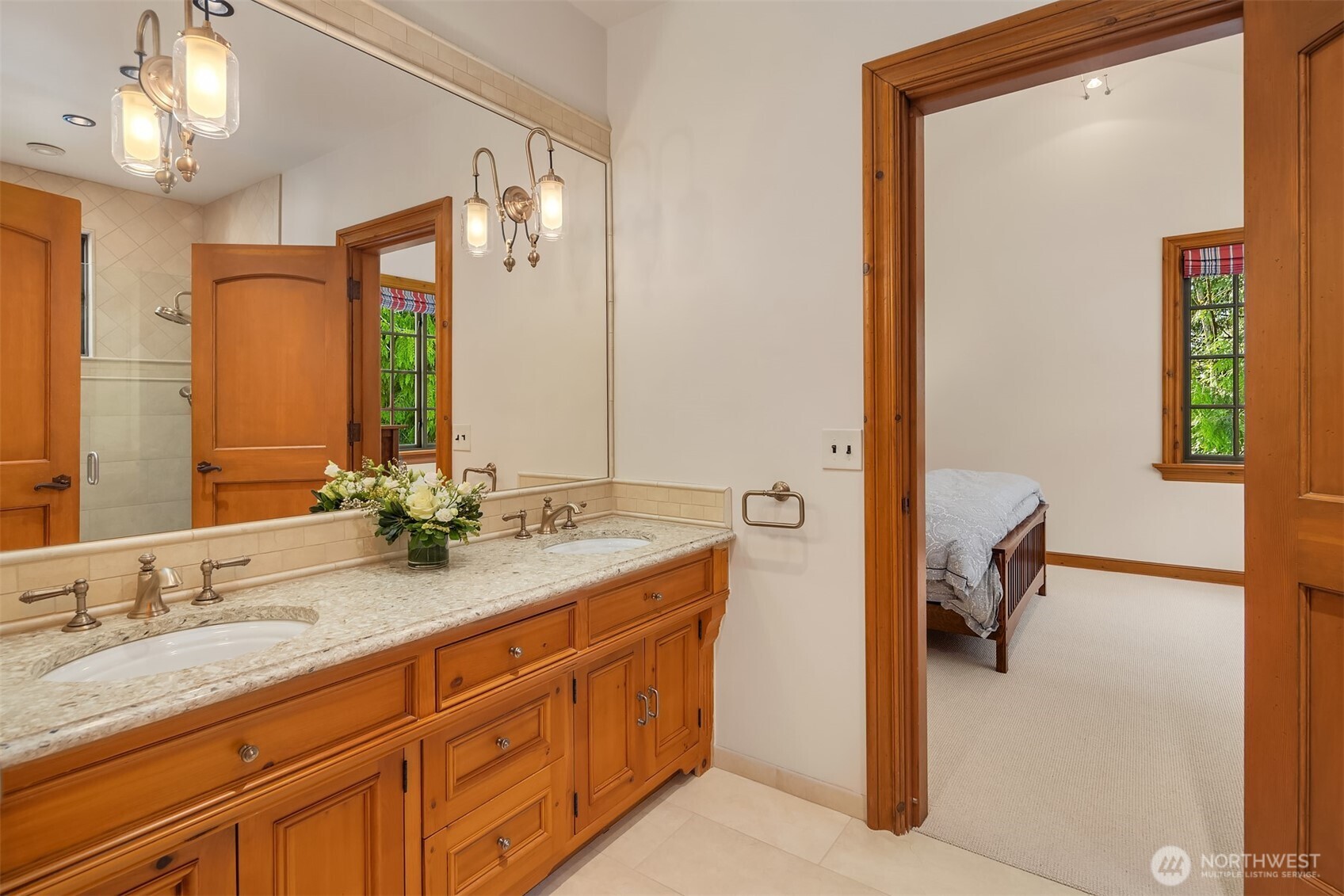 5565 248th Place Southeast Issaquah, WA 98029 - Photo 23 of 33 a en suite bathroom with a granite countertop sink and a mirror