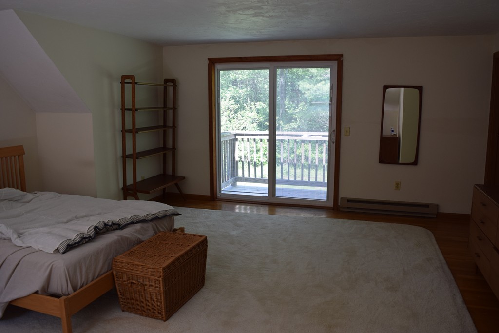 336 Sterling Road Holden, MA 01522 - Photo 16 of 16 a bed sitting in a spacious bedroom next to a window