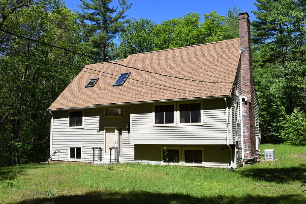 336 Sterling Road Holden, MA 01522 - Photo 4 of 16 a front view of a house with a yard