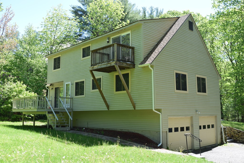 336 Sterling Road Holden, MA 01522 - Photo 8 of 16 a view of a house with a yard