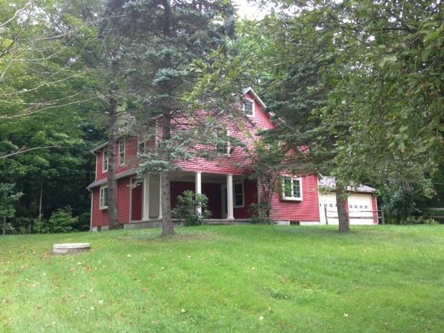 816 Roxbury Road Southbury, CT 06488 - Photo 1 of 1 a front view of a house with a garden and plants
