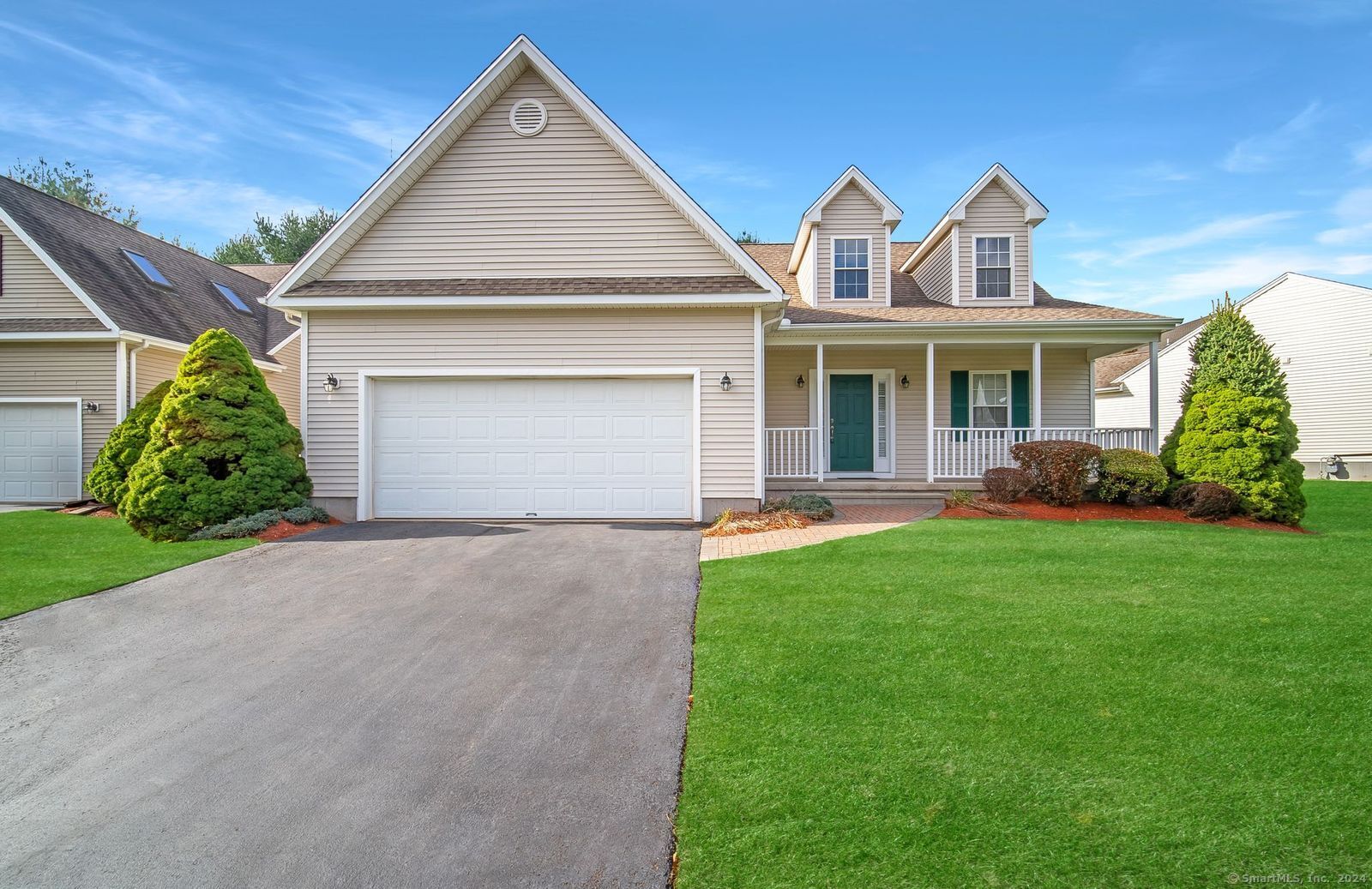 1125 West Woods Road, Unit 35 Hamden, CT 06518 - Photo 1 of 1 a front view of a house with a yard and garage