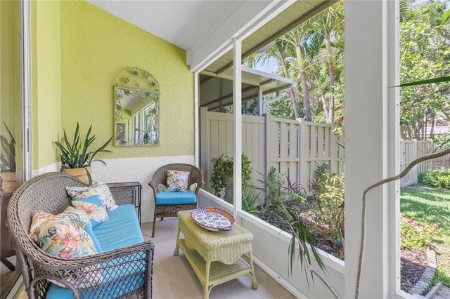 a en suite bathroom with a double vanity sink a mirror and a bathtub