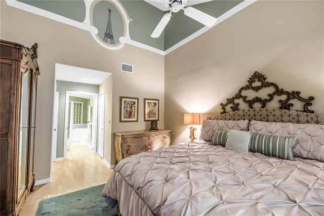 a bed room with lots of furniture and book shelf