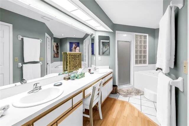 a bedroom with a bed a dresser and book shelf